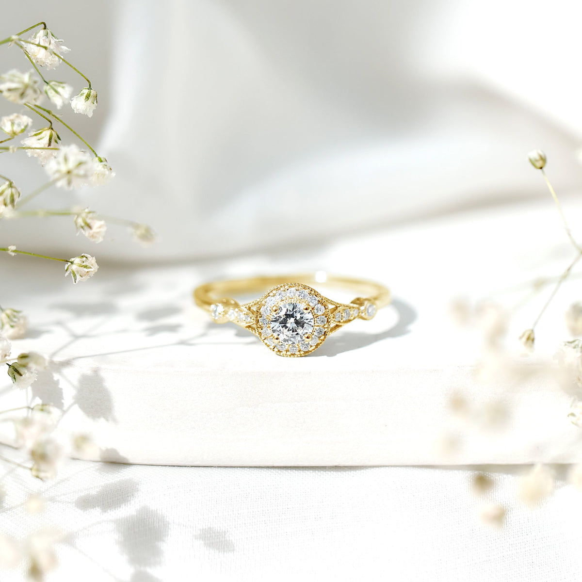 Antique-inspired zircon halo engagement ring by Rosec Jewels featuring a central zircon stone surrounded by a detailed vintage-style setting.