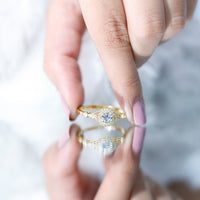 Antique-inspired zircon halo engagement ring by Rosec Jewels featuring a central gemstone surrounded by intricate vintage detailing.