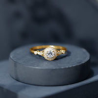 Antique-inspired zircon halo engagement ring from Rosec Jewels featuring a central stone surrounded by intricate detailing.
