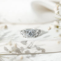 Vintage-inspired zircon halo engagement ring with intricate detailing, featuring sparkling stones and a classic design by Rosec Jewels.