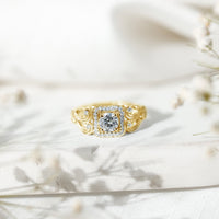 Vintage-inspired zircon halo engagement ring by Rosec Jewels featuring a central zircon stone surrounded by a detailed band.