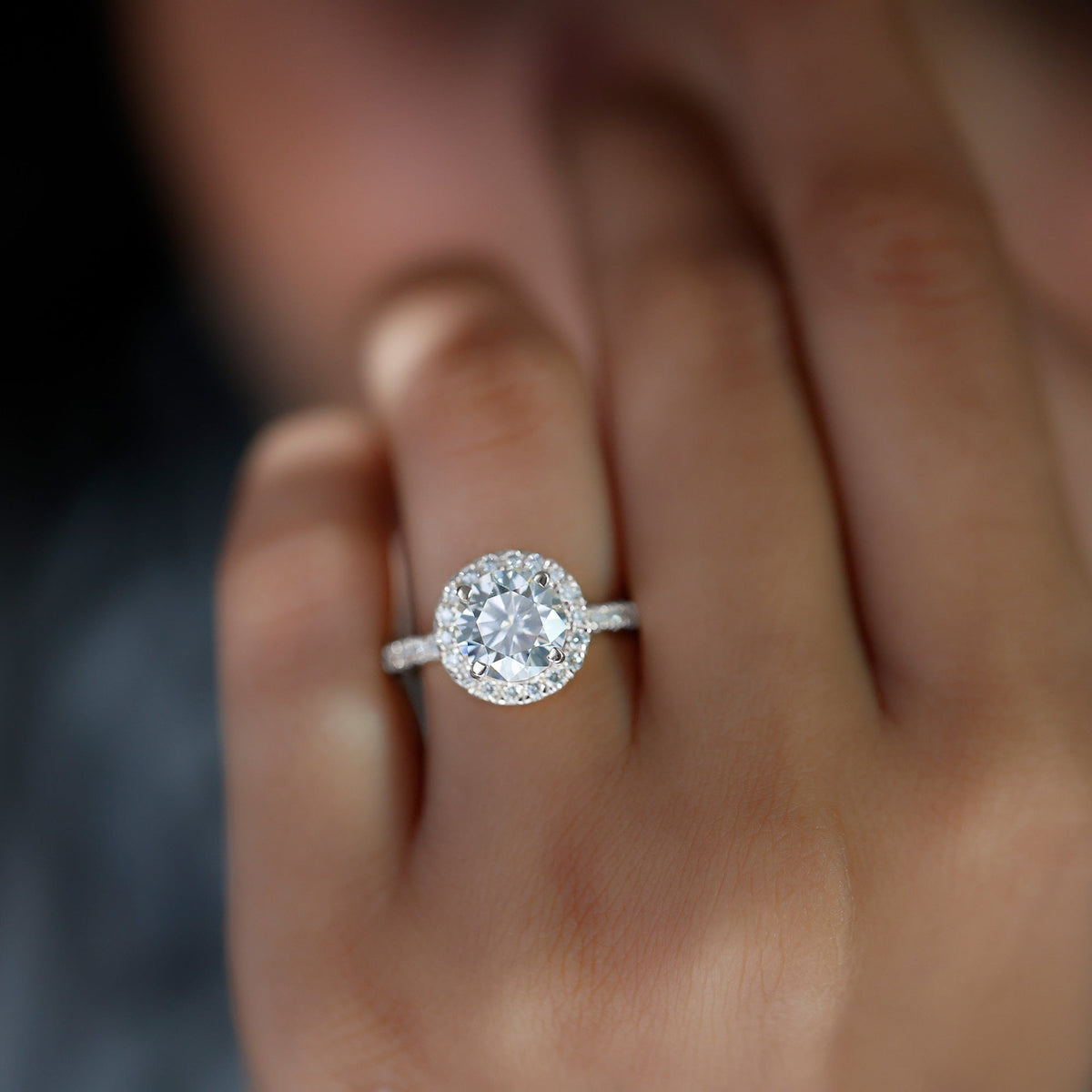 Rosec Jewels cubic zirconia floating halo engagement ring showcasing a sparkling center stone and delicate band design.