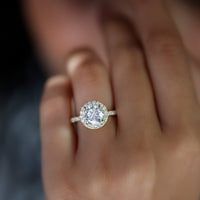 Elegant rose gold cubic zirconia floating halo engagement ring by Rosec Jewels, showcasing a sparkling central stone and intricate design.