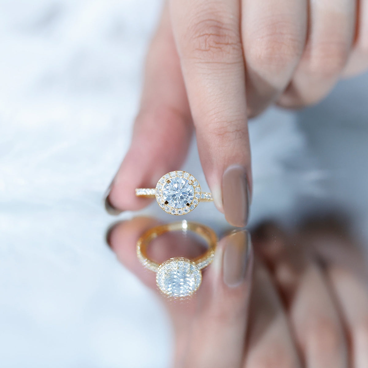 Certified cubic zirconia floating halo engagement ring from Rosec Jewels featuring a classic design with sparkling stones on a silver band.