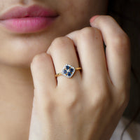 Blue sapphire cluster ring with diamond accents, 1/2 carat total weight, crafted by Rosec Jewels, showcasing a elegant jewelry design.