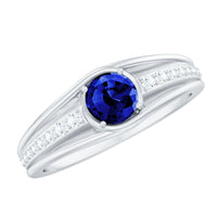 Created blue sapphire and diamond engagement ring by Rosec Jewels, featuring a central blue sapphire with surrounding diamonds.