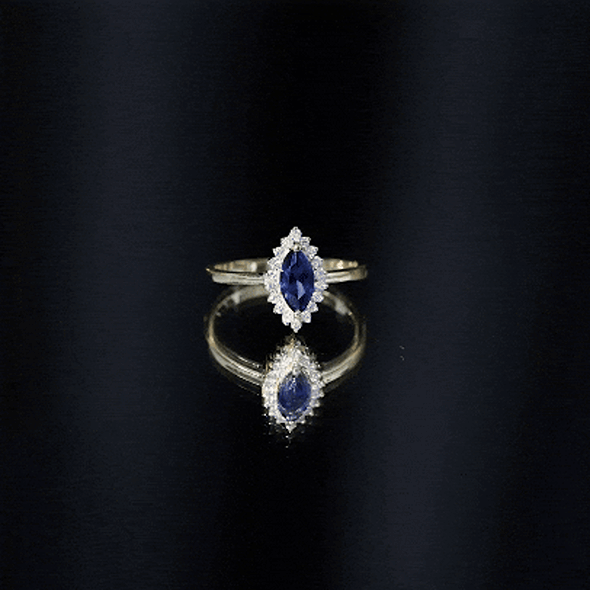 Marquise cut lab-grown blue sapphire and diamond halo engagement ring by Rosec Jewels, showcasing a sparkling blue gemstone and intricate setting.