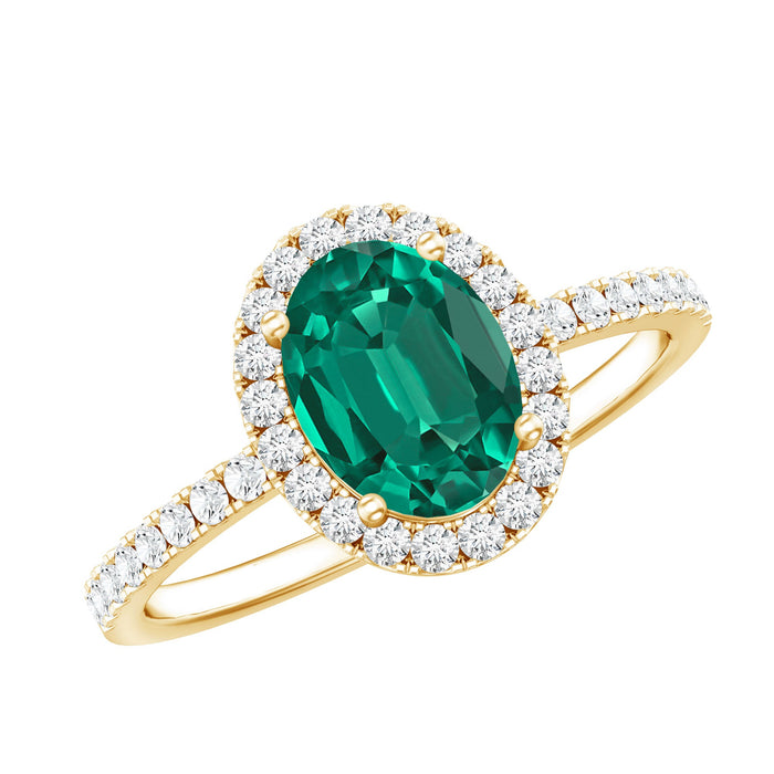 Oval lab-grown emerald engagement ring with diamond halo from Rosec Jewels, showcasing a sparkling green gemstone and elegant design.