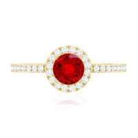 Lab-created ruby and diamond halo engagement ring featuring a 0.6 carat ruby center stone with Rosec Jewels' intricate ring design.