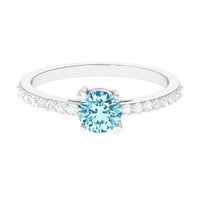 Rosec Jewels aquamarine solitaire engagement ring with diamond, featuring a sleek band and elegant gemstone setting.