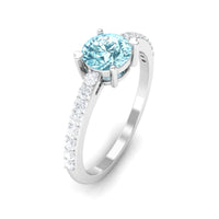 Rosec Jewels aquamarine solitaire engagement ring with diamond, featuring a sleek design and elegant gemstone setting.