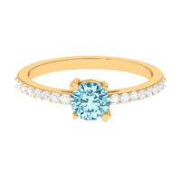 Rosec Jewels aquamarine solitaire engagement ring with diamond, featuring a sleek band and a prominent aquamarine center stone.