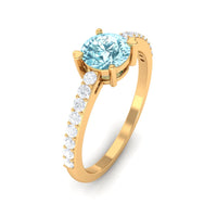 Rosec Jewels aquamarine solitaire engagement ring with diamond, featuring a sleek design and shiny metal band.