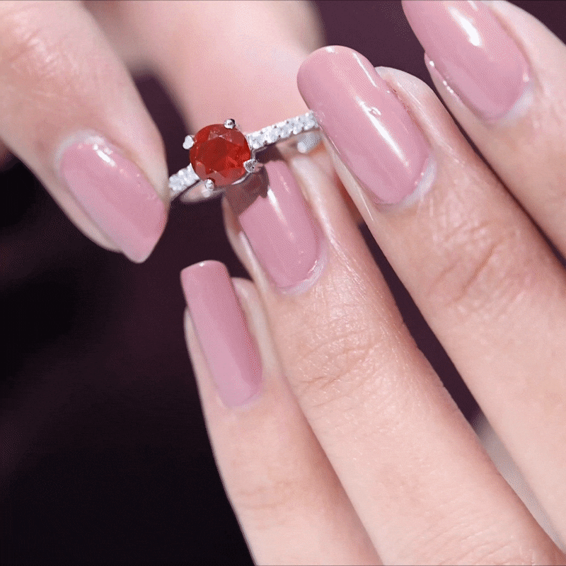 Rosec Jewels designer fire opal promise ring with diamond accents, showcasing a vibrant orange-red gemstone and sparkling details.