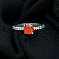 Rosec Jewels designer fire opal promise ring with diamond accents, showcasing vibrant orange gemstone and elegant band design.
