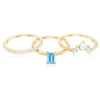 Set of three Rosec Jewels emerald cut aquamarine solitaire rings with diamond accents, showcasing elegant gemstone and silver band details.