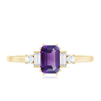 Emerald cut 1.4 carat amethyst engagement ring with diamond accents by Rosec Jewels, showcasing a silver band and intricate design.