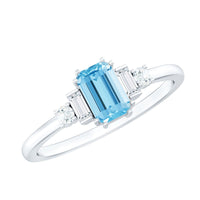 Emerald cut aquamarine engagement ring with diamond accents by Rosec Jewels, showcasing a 0.6 carat gemstone and elegant design.