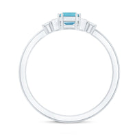 Emerald cut aquamarine and diamond engagement ring by Rosec Jewels, showcasing a 0.6 carat aquamarine gemstone and sparkling diamonds.
