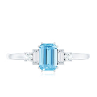 Emerald cut 0.6 carat aquamarine engagement ring with diamond accents by Rosec Jewels, showcasing the elegant ring setting.