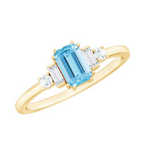 Emerald cut aquamarine engagement ring with diamond accents from Rosec Jewels, showcasing the gemstone and intricate band details.