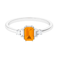 Emerald cut fire opal engagement ring with diamond accents by Rosec Jewels, showcasing the ring’s elegant design and vibrant gemstone.