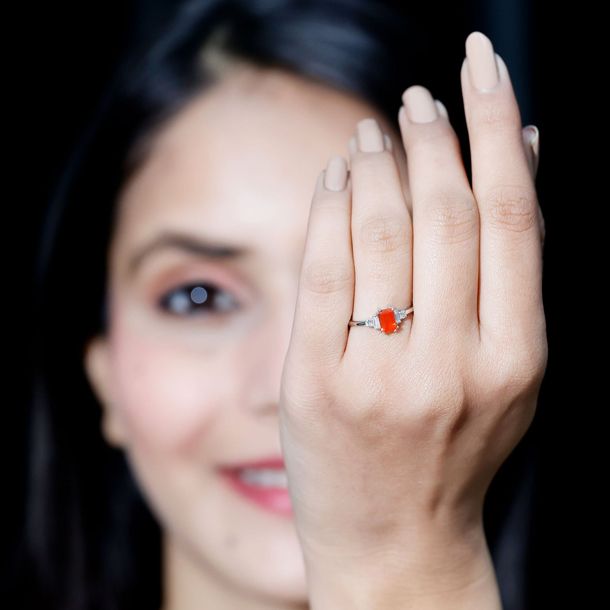 Emerald cut fire opal engagement ring with diamonds from Rosec Jewels, showcasing the elegant gemstone and sparkling accents.