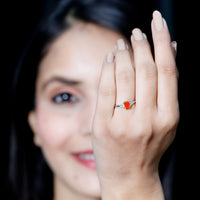 Emerald cut fire opal engagement ring with diamonds from Rosec Jewels, showcasing the elegant gemstone and sparkling accents.
