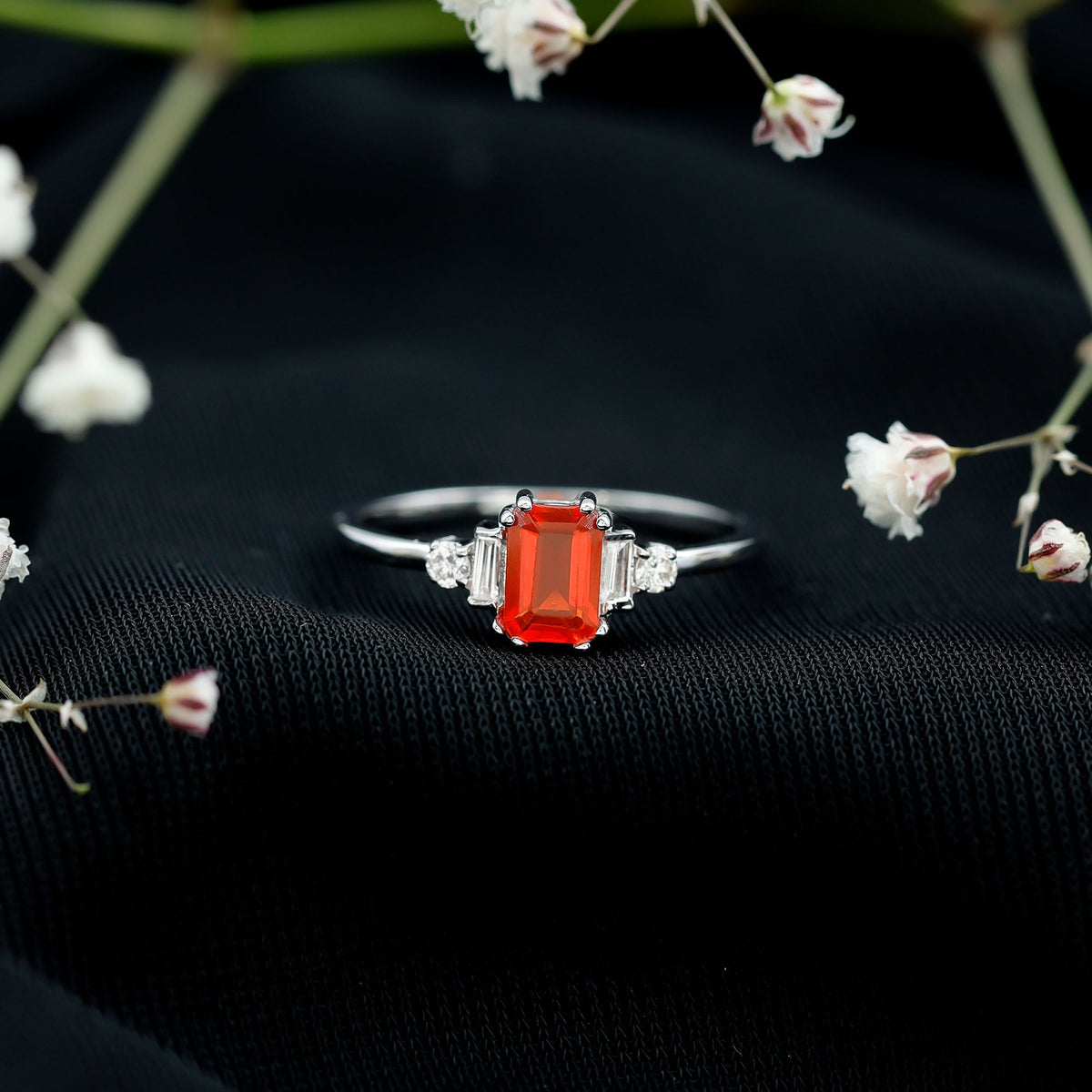 Emerald cut fire opal engagement ring with diamonds from Rosec Jewels, showcasing a 1-carat fiery gemstone and sparkling accents.