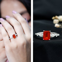 Emerald cut 1-carat fire opal engagement ring with diamond side stones from Rosec Jewels, showcasing a sparkling center gemstone and side accents.