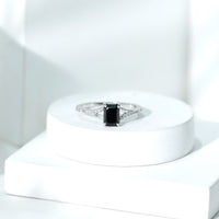 Lab grown black diamond engagement ring with white diamonds, emerald cut, split shank design from Rosec Jewels.