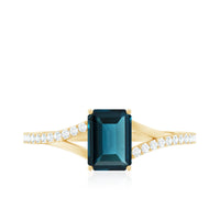 6X8mm Emerald Cut London Blue Topaz Split Shank Engagement Ring with Diamond