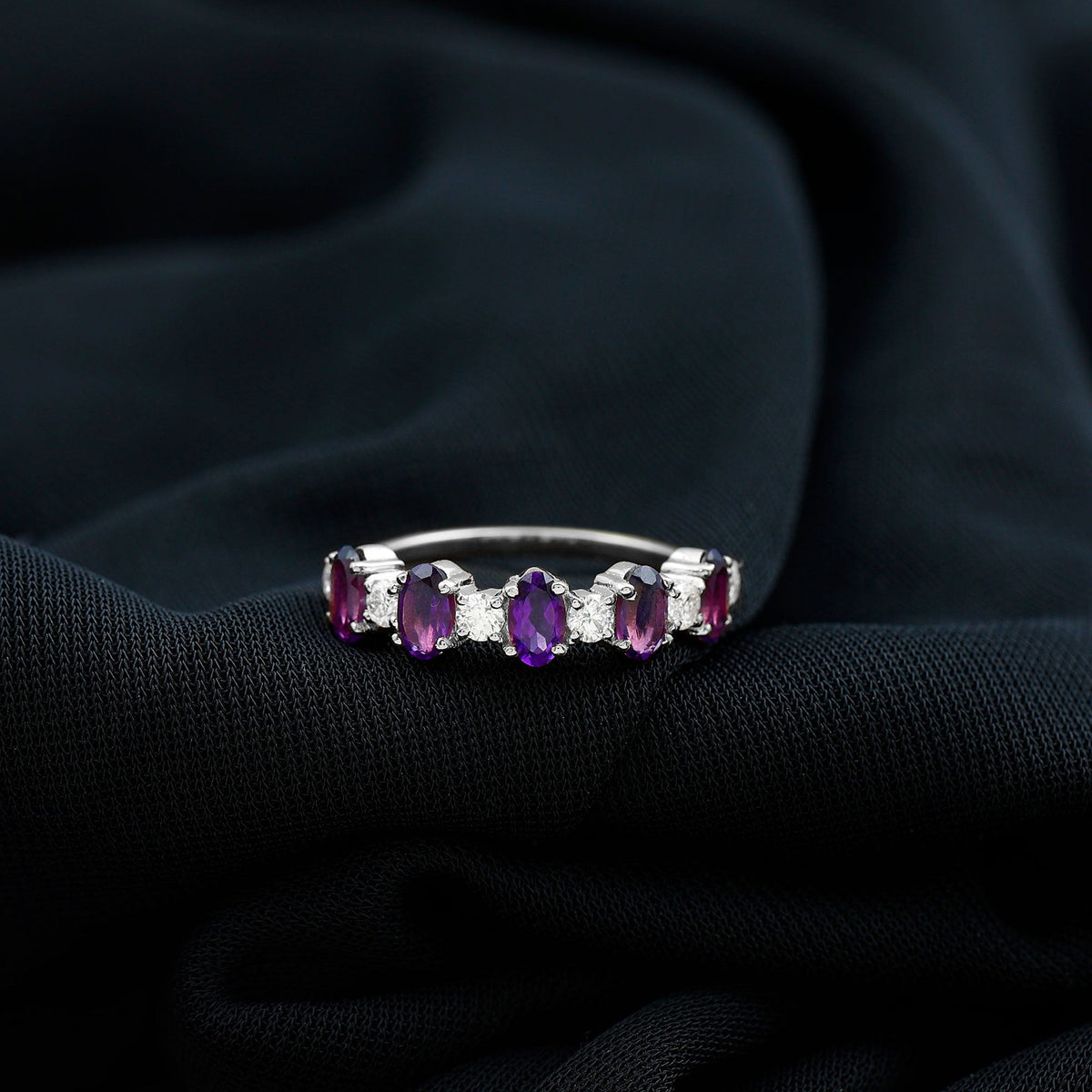 Natural oval amethyst and diamond half eternity ring for women by Rosec Jewels, showcasing elegant gemstone setting and fine craftsmanship.
