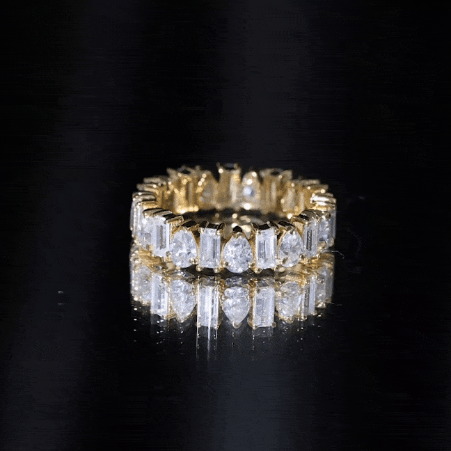 Yellow gold Pear and Baguette Cut Moissanite eternity band ring by Rosec Jewels featuring alternating gemstone design.