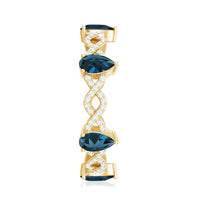 Pear Shape London Blue Topaz Crossover Eternity Band with Diamond