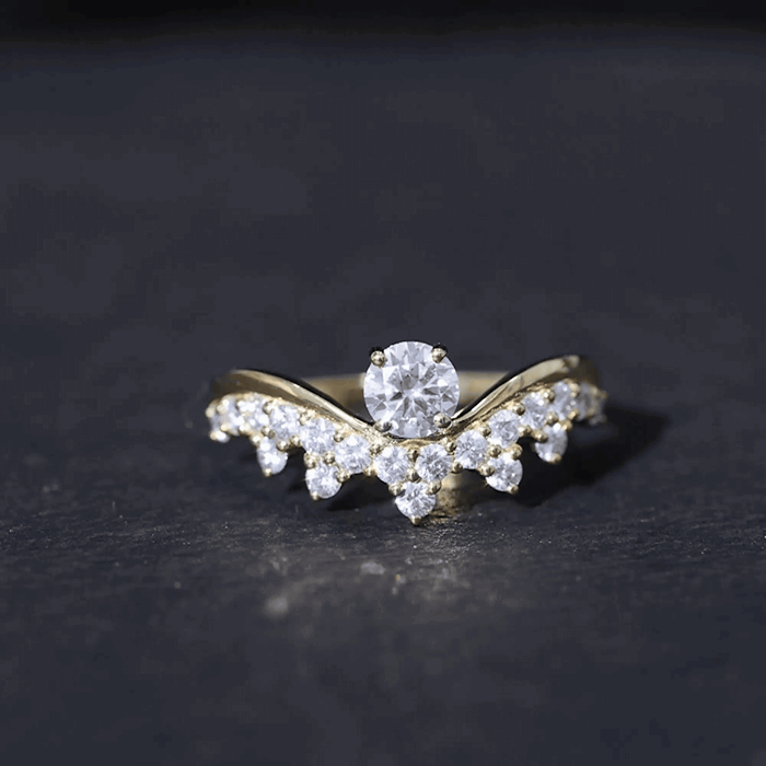 Yellow gold moissanite curved engagement ring for women by Rosec Jewels, showcasing sparkling stones and elegant design.