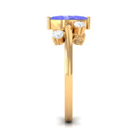 Rosec Jewels 1 CT marquise tanzanite solitaire ring with scatter diamonds, showcasing an elegant and minimal design.