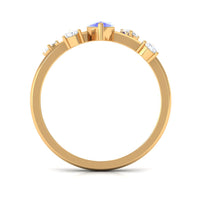 Marquise Tanzanite solitaire ring with scattered diamonds by Rosec Jewels, showcasing a 1-carat gemstone and elegant design.
