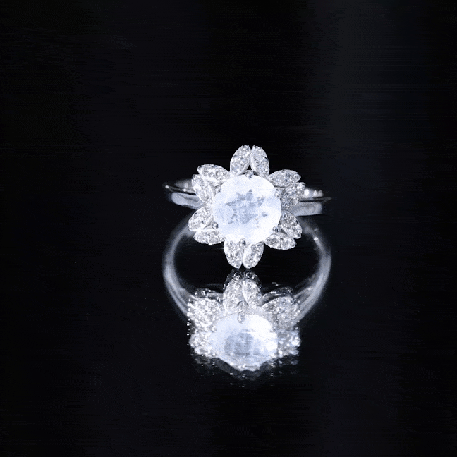 Yellow gold engagement ring with 0.85 CT moonstone center surrounded by diamond floral halo, from Rosec Jewels.