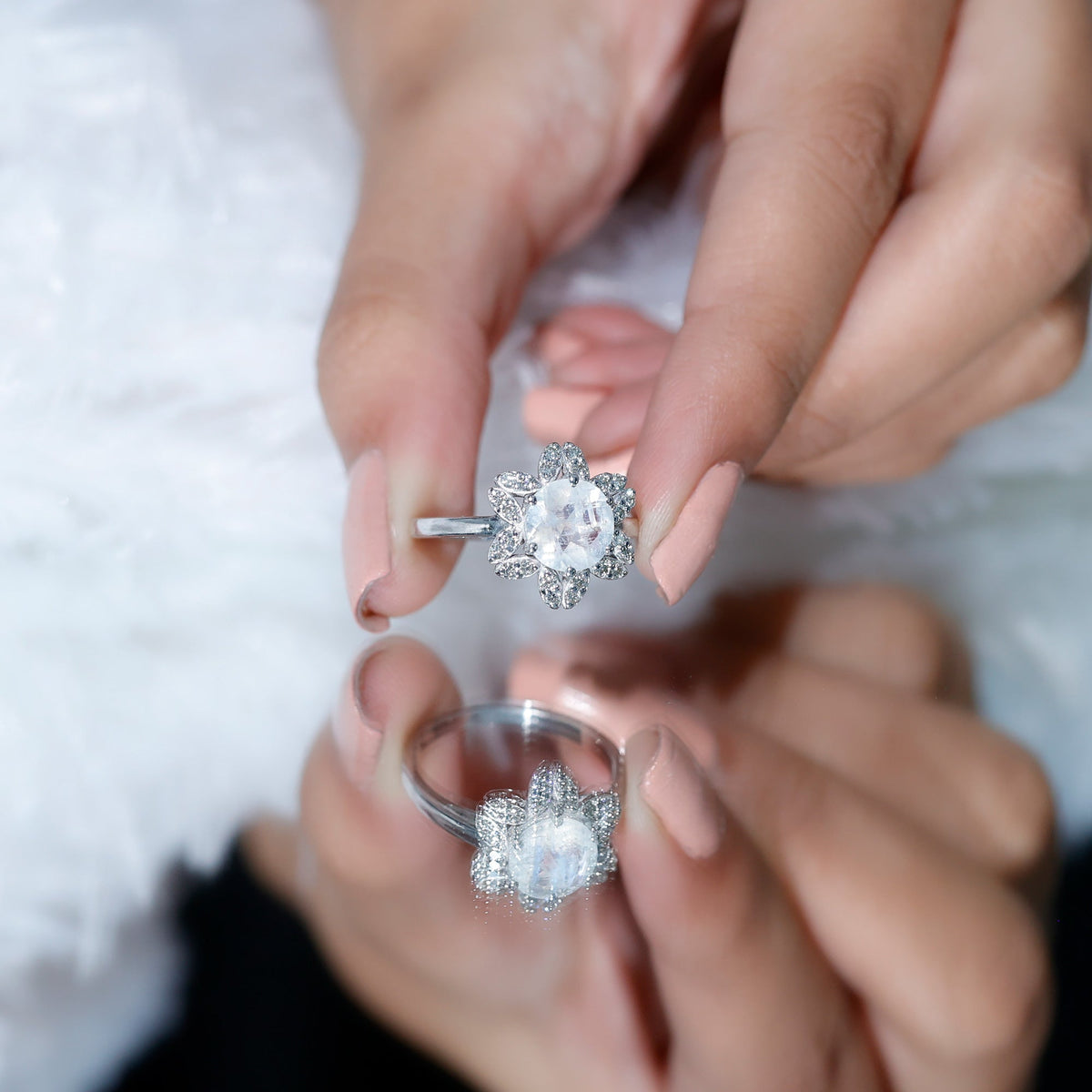 Rosec Jewels 0.85 CT moonstone and diamond floral halo engagement ring, showcasing intricate floral design and sparkling gemstones.