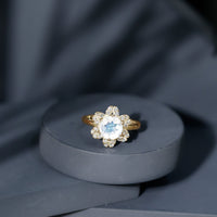 0.85 ct moonstone and diamond floral halo engagement ring by Rosec Jewels, featuring delicate floral design and sparkling accents.