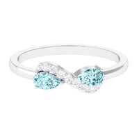 Rosec Jewels 1/2 CT pear-shaped aquamarine infinity promise ring with diamond accents, showcasing elegant jewelry design.