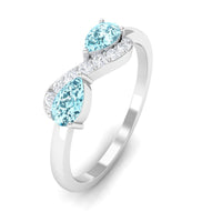 Rosec Jewels 1/2 CT pear-shaped aquamarine infinity promise ring with diamond accents, showcasing a delicate and elegant design.