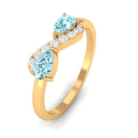 Rosec Jewels 1/2 CT pear-shaped aquamarine infinity promise ring with diamond accents, showcasing elegant silver band and detailed design