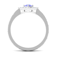 Minimal Tanzanite and diamond ring featuring a 3/4 carat center stone, set in a sleek band, by Rosec Jewels.