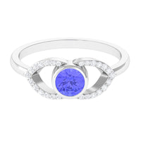 Bezel set tanzanite solitaire ring with split shank design and diamond accents by Rosec Jewels