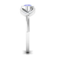 Bezel set tanzanite solitaire split shank ring with diamond accents, crafted by Rosec Jewels, showcasing elegant jewelry design.