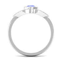 Bezel set tanzanite solitaire ring with split shank design and diamond accents by Rosec Jewels.