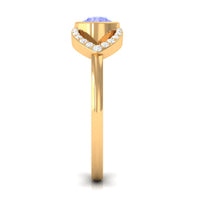 Bezel set tanzanite solitaire split shank ring with diamond accents from Rosec Jewels, showcasing elegant jewelry design.