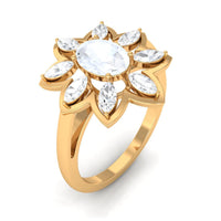 Oval cut moonstone and diamond flower cocktail ring by Rosec Jewels, featuring a stunning oval moonstone centerpiece with surrounding diamonds.